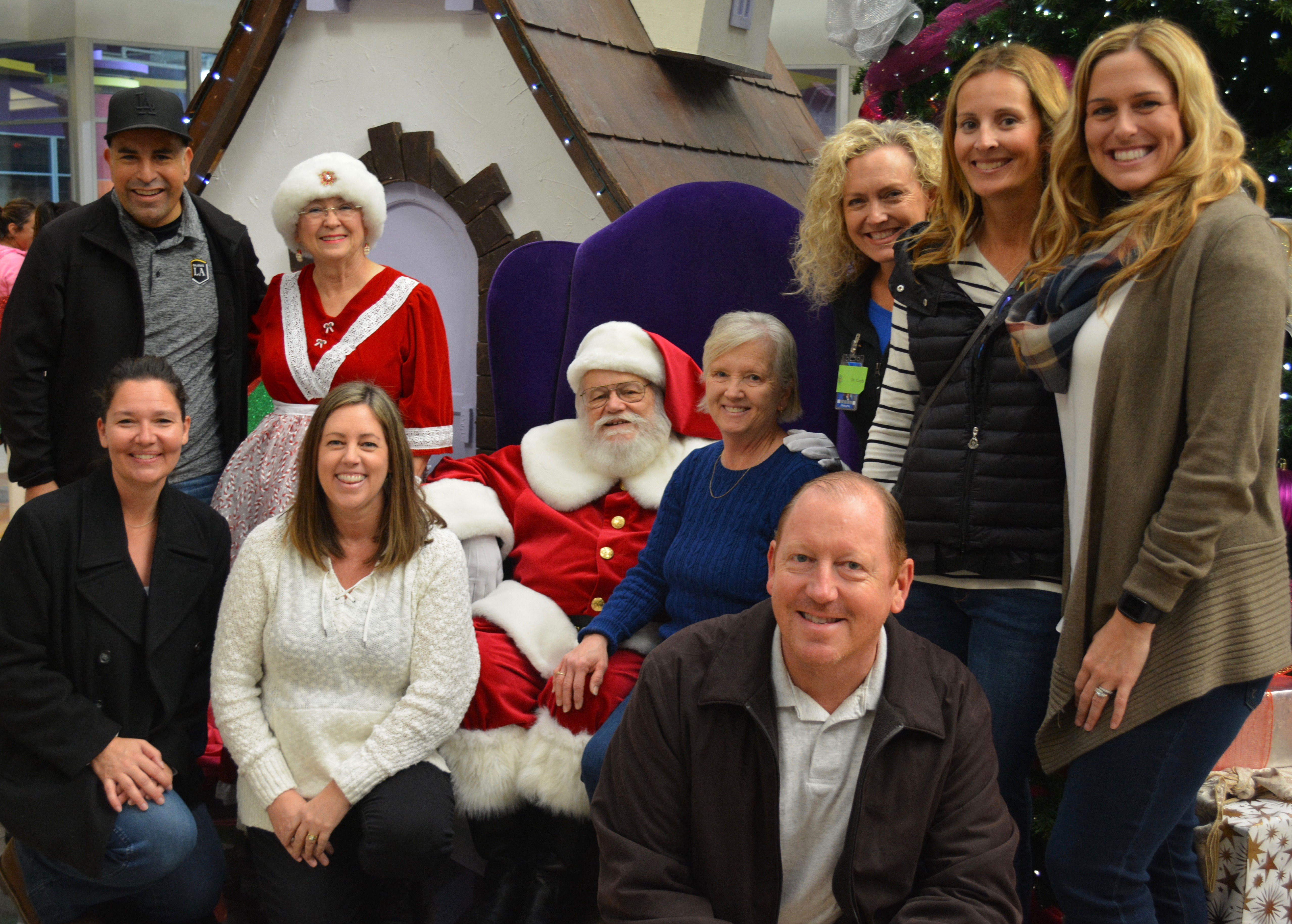 Orange Savanna's Administrators Visit with Santa at the Buena Park Shopping Spree. Orange